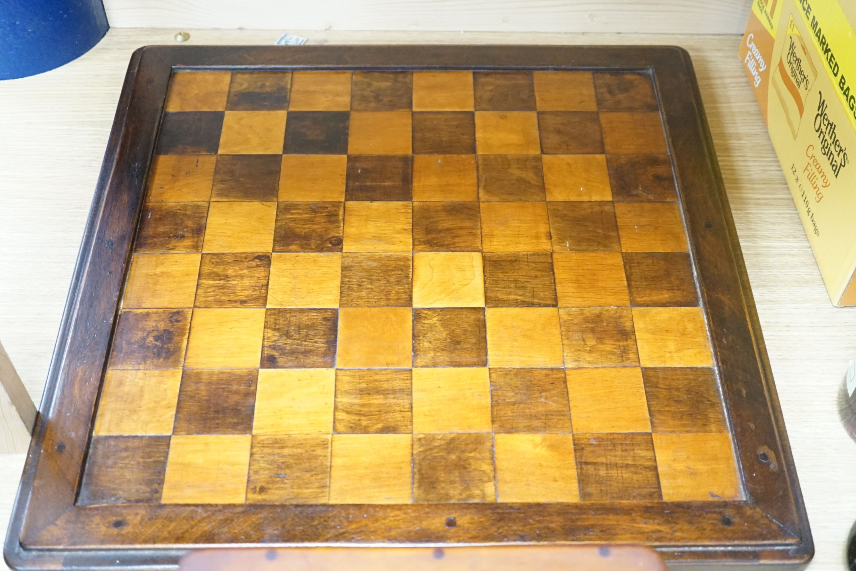 An early 20th century turned wood Staunton pattern chess set and inlaid board